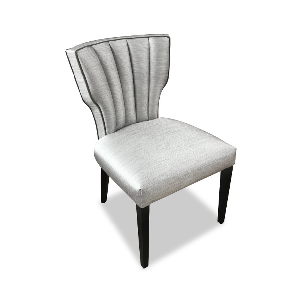 With generously padded vertical fluting and tram-line contrasting piping the Vigo is an opulent, fashionable chair that functions as both dining seat or side chair equally well. Carefully tailoring and attention to detail sets the Vigo apart.
