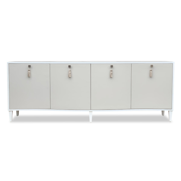 Capturing the elegance and romance of the Seychelles this sideboard of the same name is handmade from natural timber and show wood.  Available in the colours of the collection or in painted RAL or Farrow & Ball finish. The curved doors are upholstered in faux leather and the solid brushed brass handles with decorative tassels channels the spirit of the island paradise. Available with or without recessed LED lighting as optional.